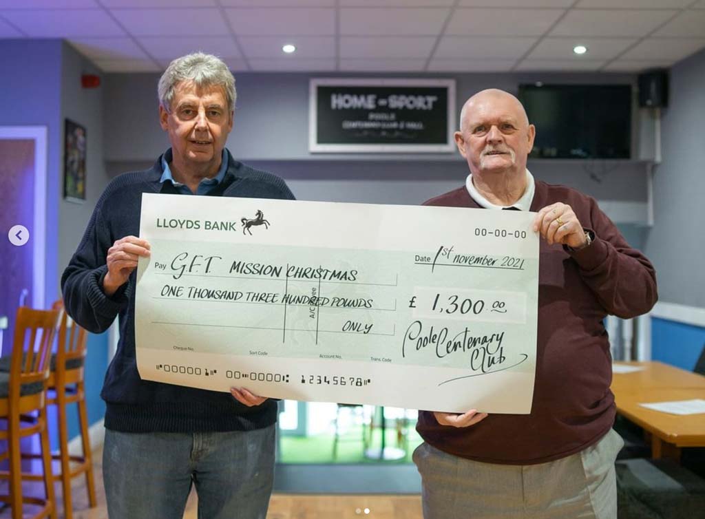 Richard Gale receiving a donation cheque from the Centenary Club Poole